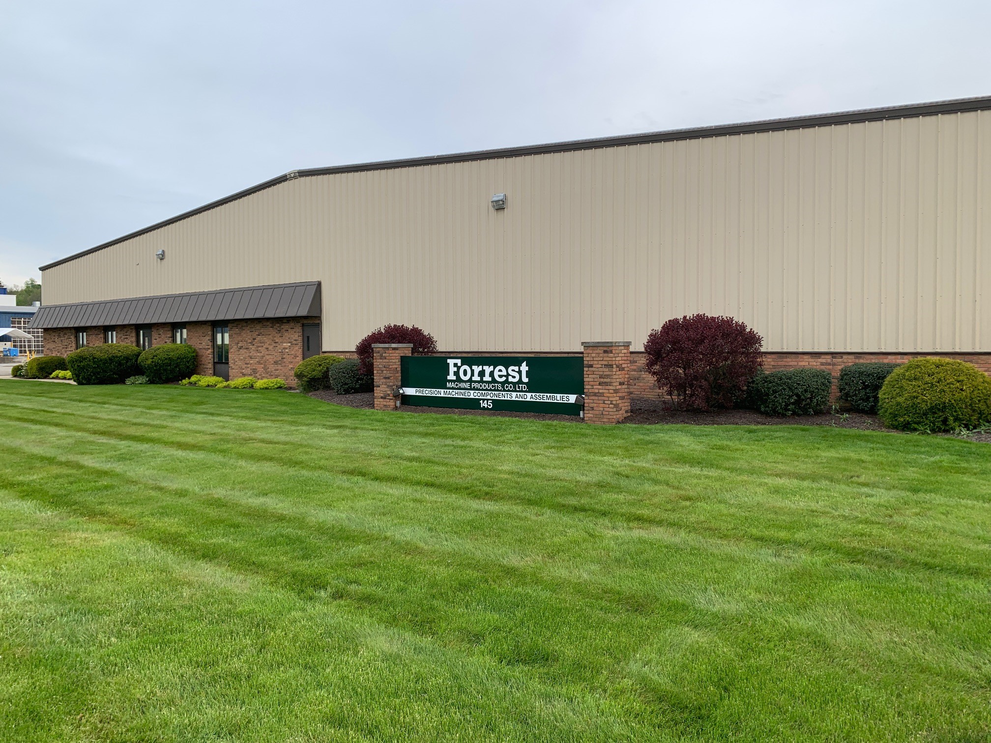 Forrest Machine Products facility exterior with company sign