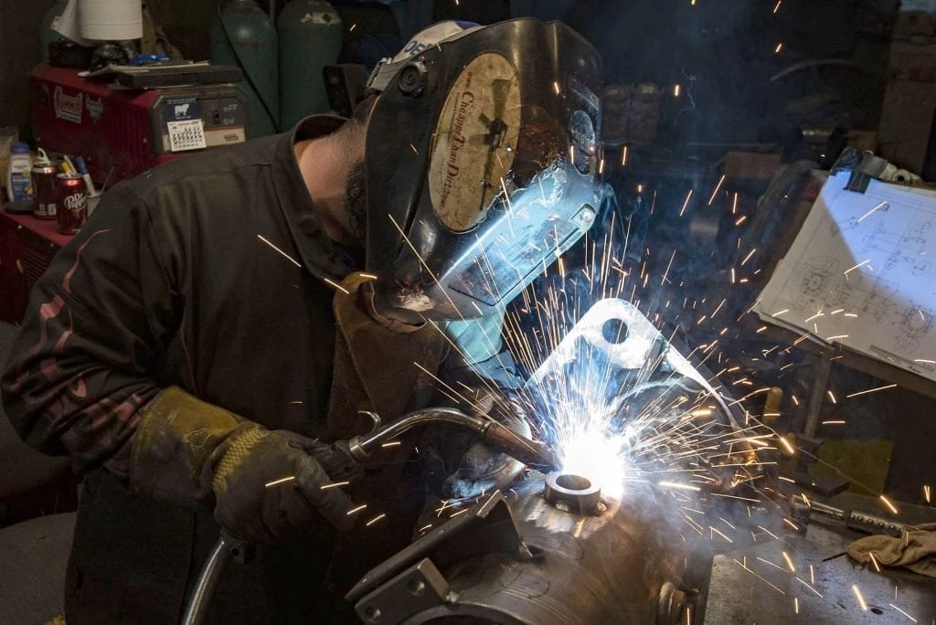 MIG welder at work on a structural weldment at Goyal Industries